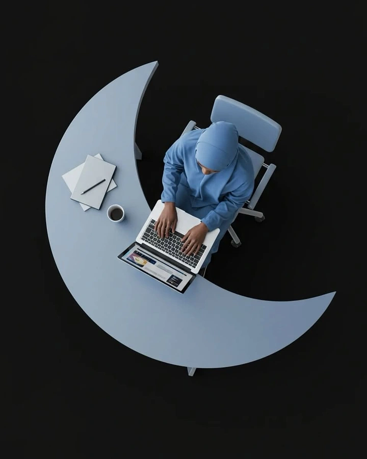 Ramadan creative ad: Top-down woman in hijab working at a crescent-shaped desk