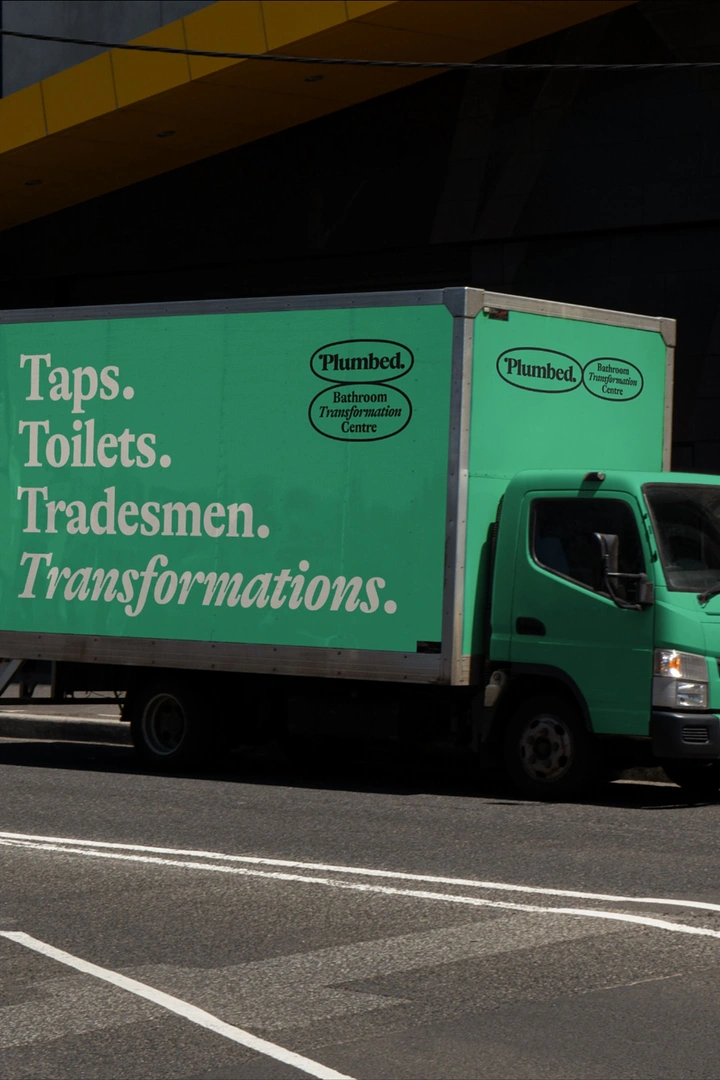 Plumbers creative ad: Alliterative 'Taps. Toilets. Tradesmen.' truck livery