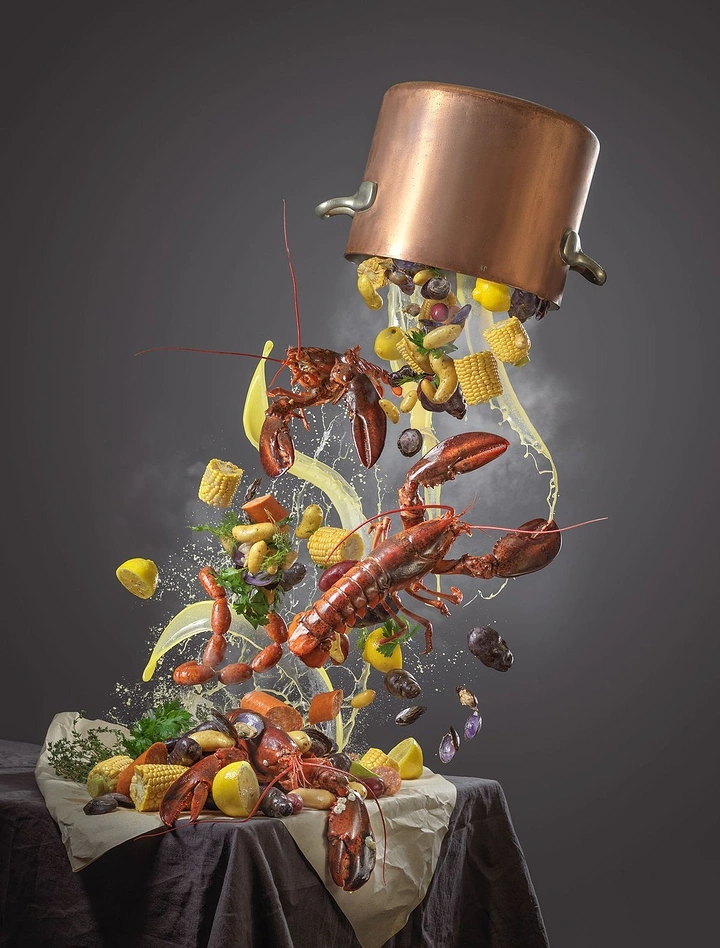 Restaurant & Cafe creative ad: Seafood boil pouring out of a floating copper pot