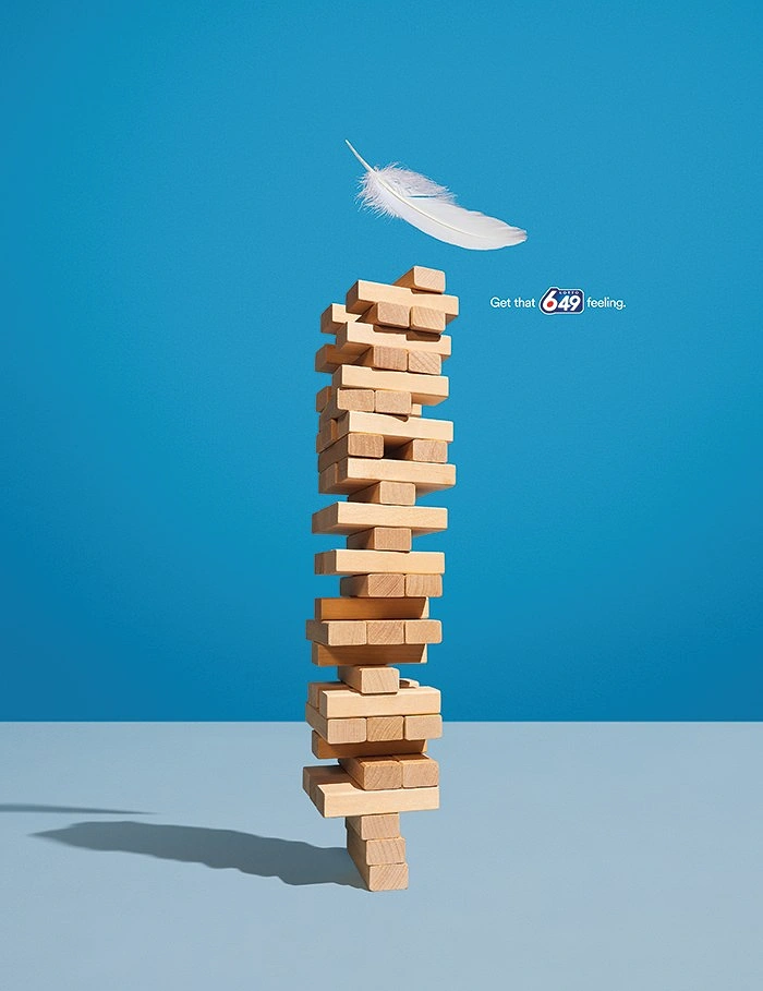 Board Games & Game Cafes creative ad: Feather adds delicate-balance metaphor