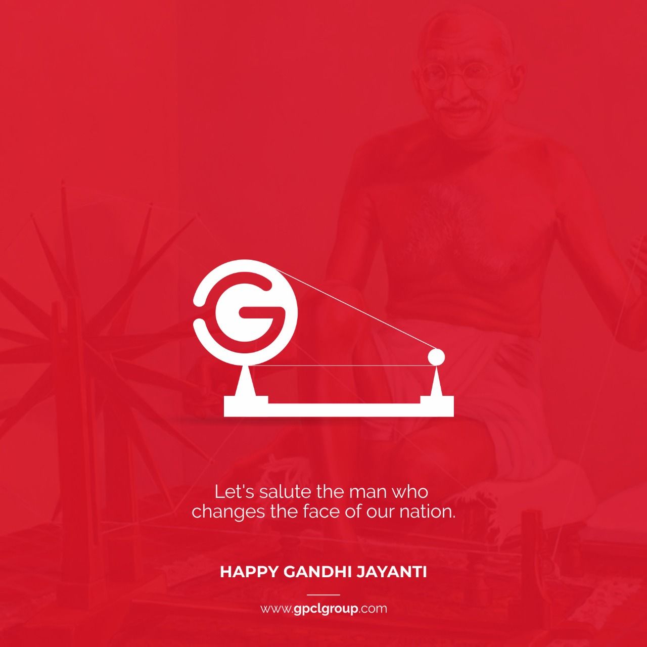 White brand-logo charkha over a red duotone photo of Gandhi spinning