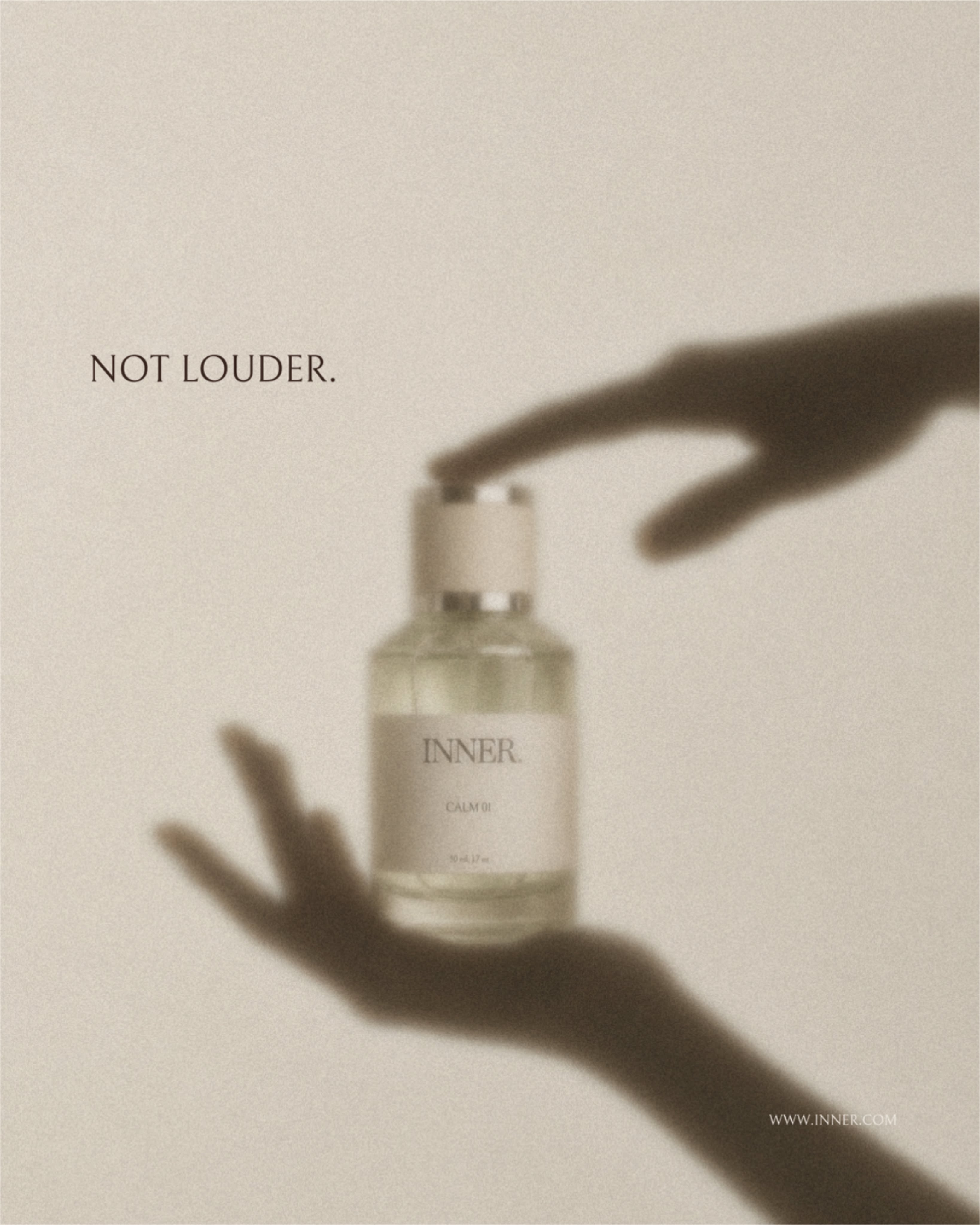 Instagram post: Perfume bottle framed by shadow silhouettes of hands