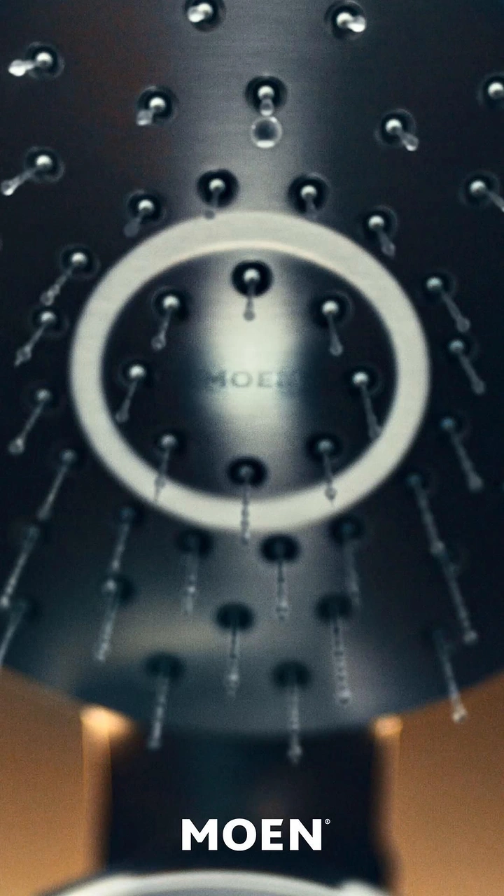 Plumbers creative ad: Dramatic upward showerhead view, ring framing