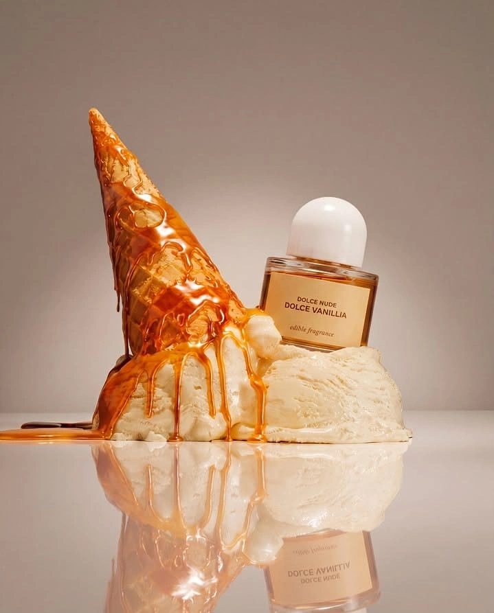 Perfume & Fragrance creative ad: Perfume bottle sunk into melting vanilla ice cream with caramel-dripped cone