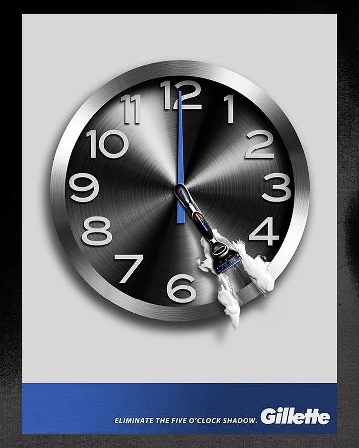 Men's Grooming Brands creative ad: Brushed-metal clock whose hour hand is a razor wiping foam at five