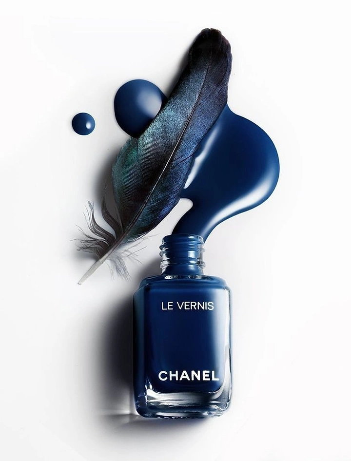 Nail Polish Brands creative ad: Polish color paired with feather and ink forms