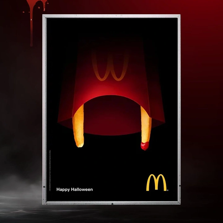 Halloween creative ad: Fries carton turned into a vampire mouth with fry fangs dripped in ketchup