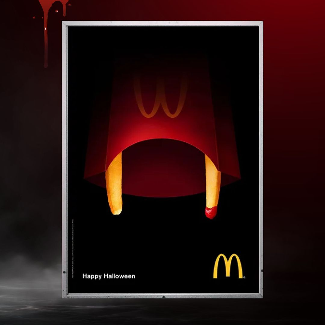 Fries carton turned into a vampire mouth with fry fangs dripped in ketchup
