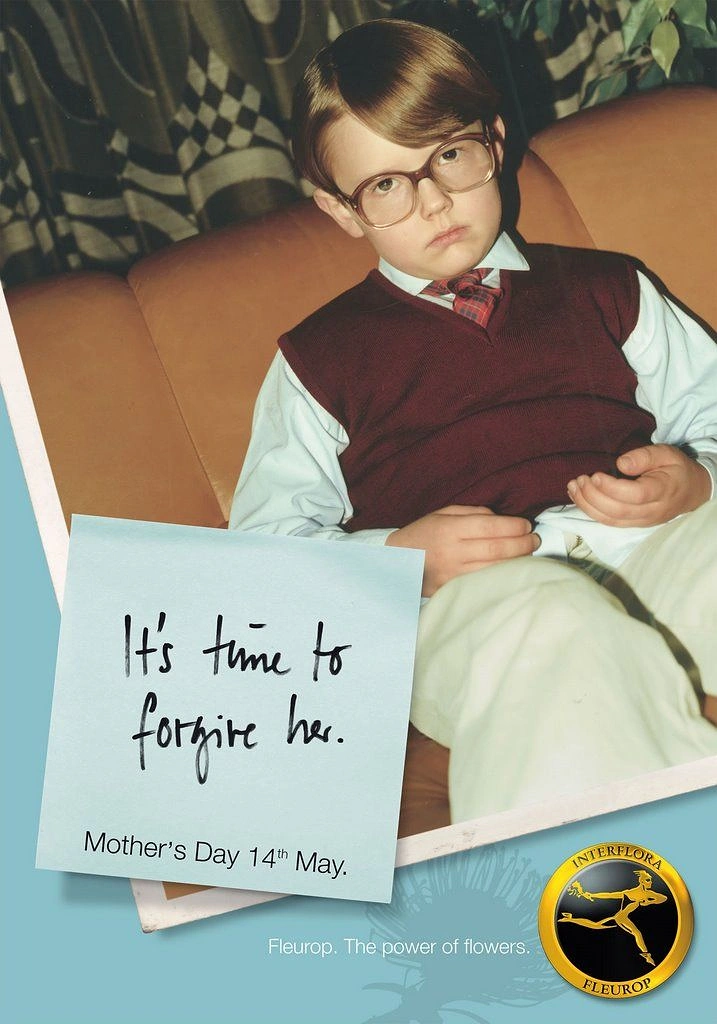 Mother's Day creative ad: Retro photo of a sulky boy in glasses and sweater vest on a sofa