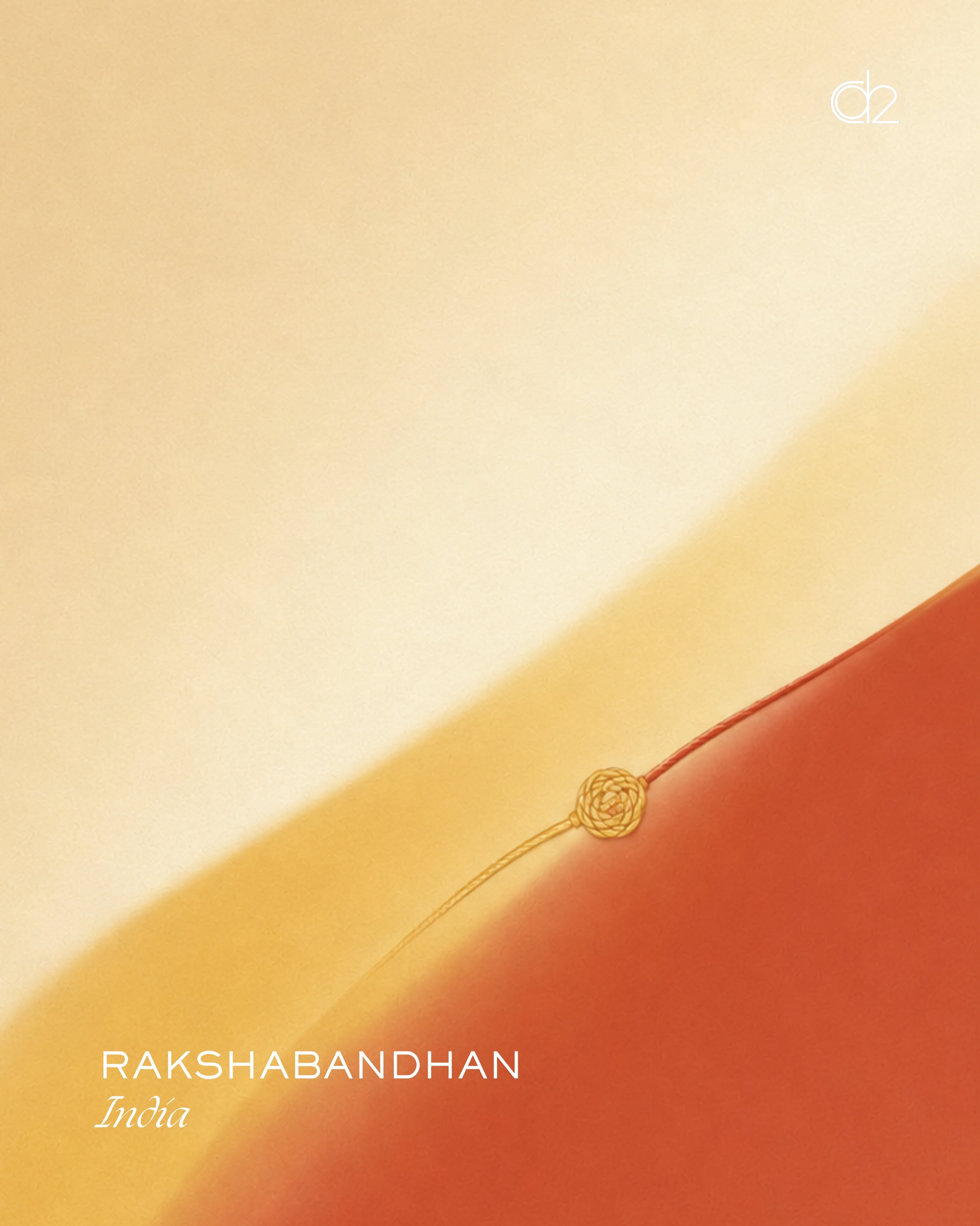 Single thin rakhi thread with a gold knot laid diagonally across a soft colour field