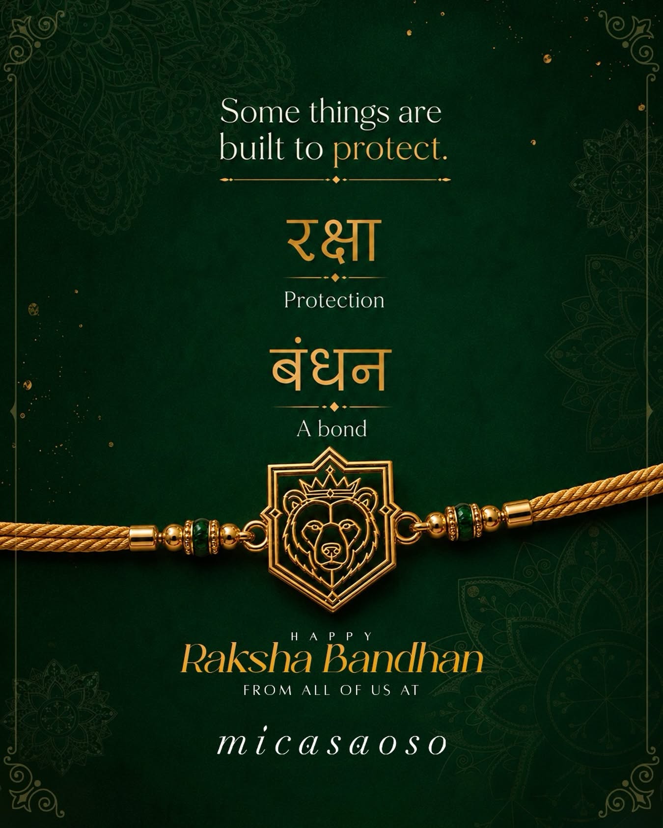 Gold rakhi with a crowned bear-head shield charm