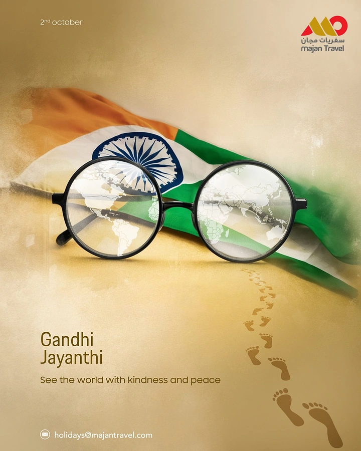 Gandhi Jayanti creative ad: Round Gandhi-style glasses reflecting a world map in front of a draped Indian flag