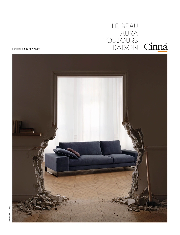 Home Decor creative ad: Navy sofa revealed through a smashed-open wall