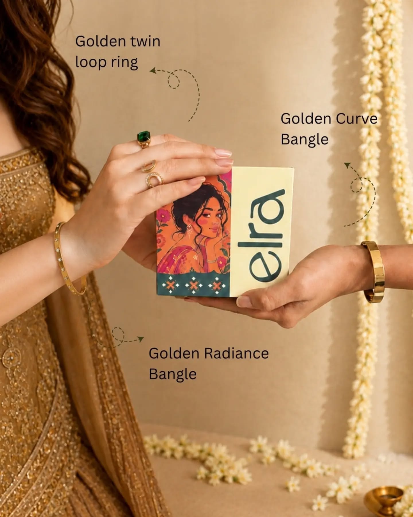 Two women's hands clasping, wearing bangles