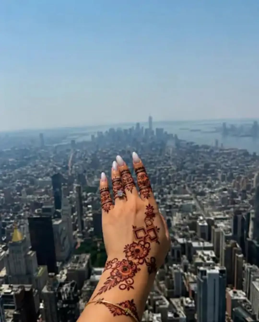 Instagram post: City-scale hands sell henna flex, slide 2