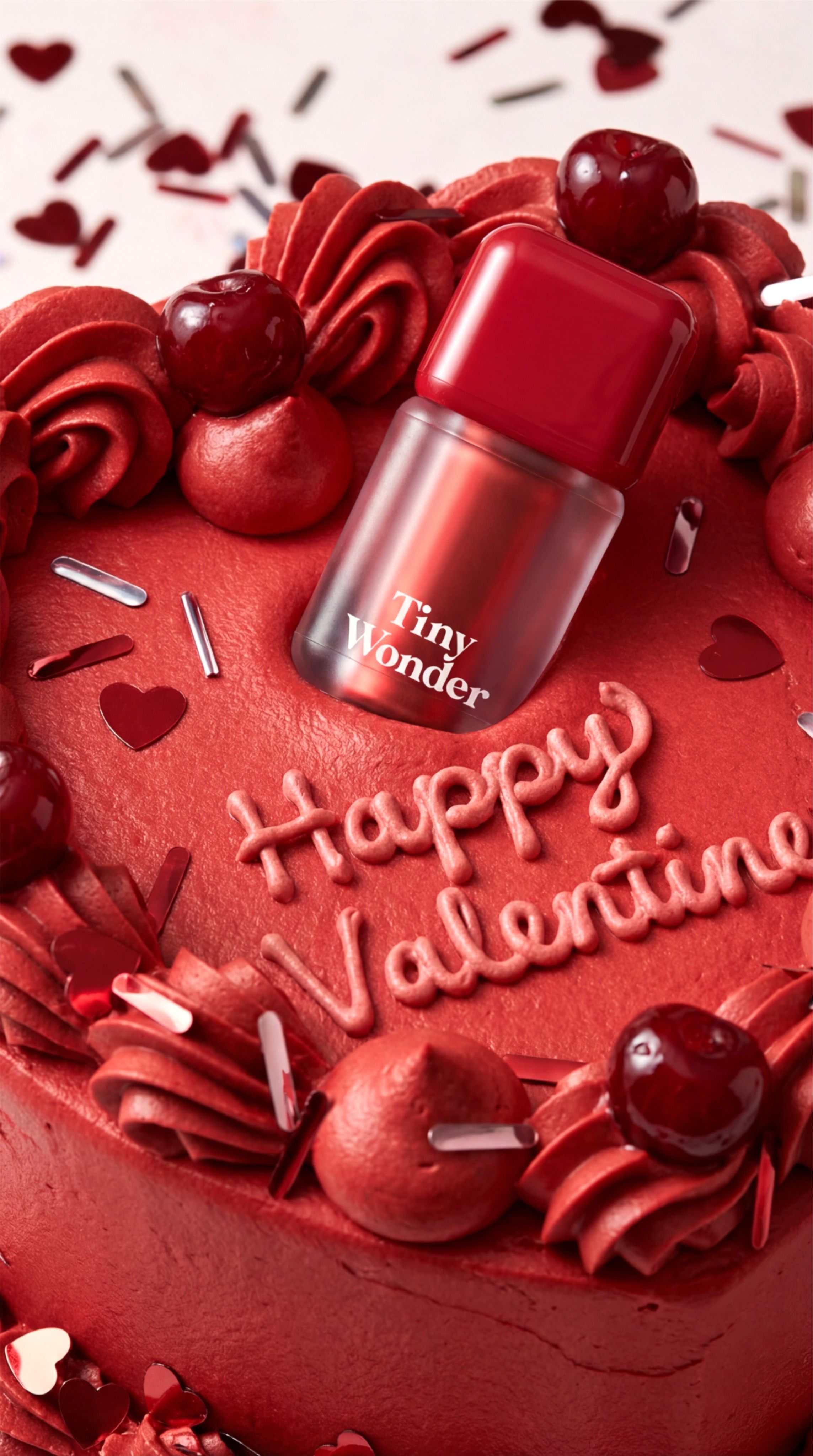 Valentine's Day Story: Red lip tint bottle set into a red heart-shaped cake