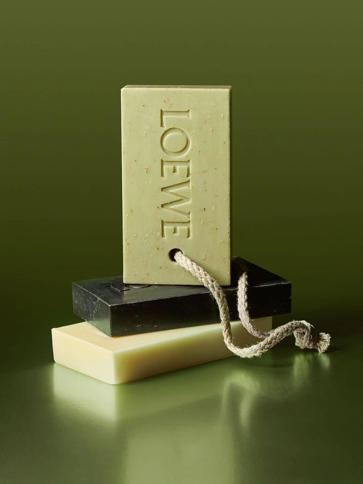 Beauty & Salon creative ad: Stack of three soap bars, top bar on a rope