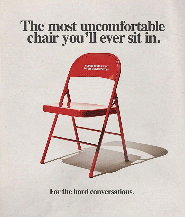 Creative ad: Red metal folding chair casting a hard shadow