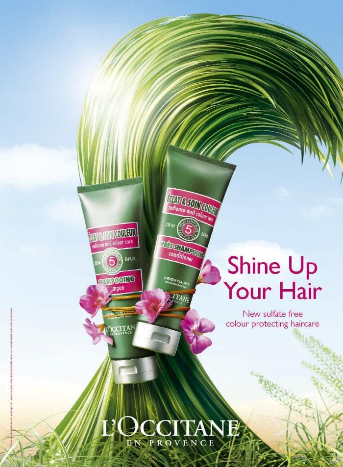Poster: Two green shampoo and conditioner tubes tied with twine and pink flowers against a huge wave of grass shaped like hair