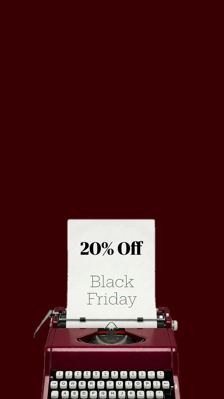 Black Friday creative ad: Burgundy vintage typewriter with a typed sheet