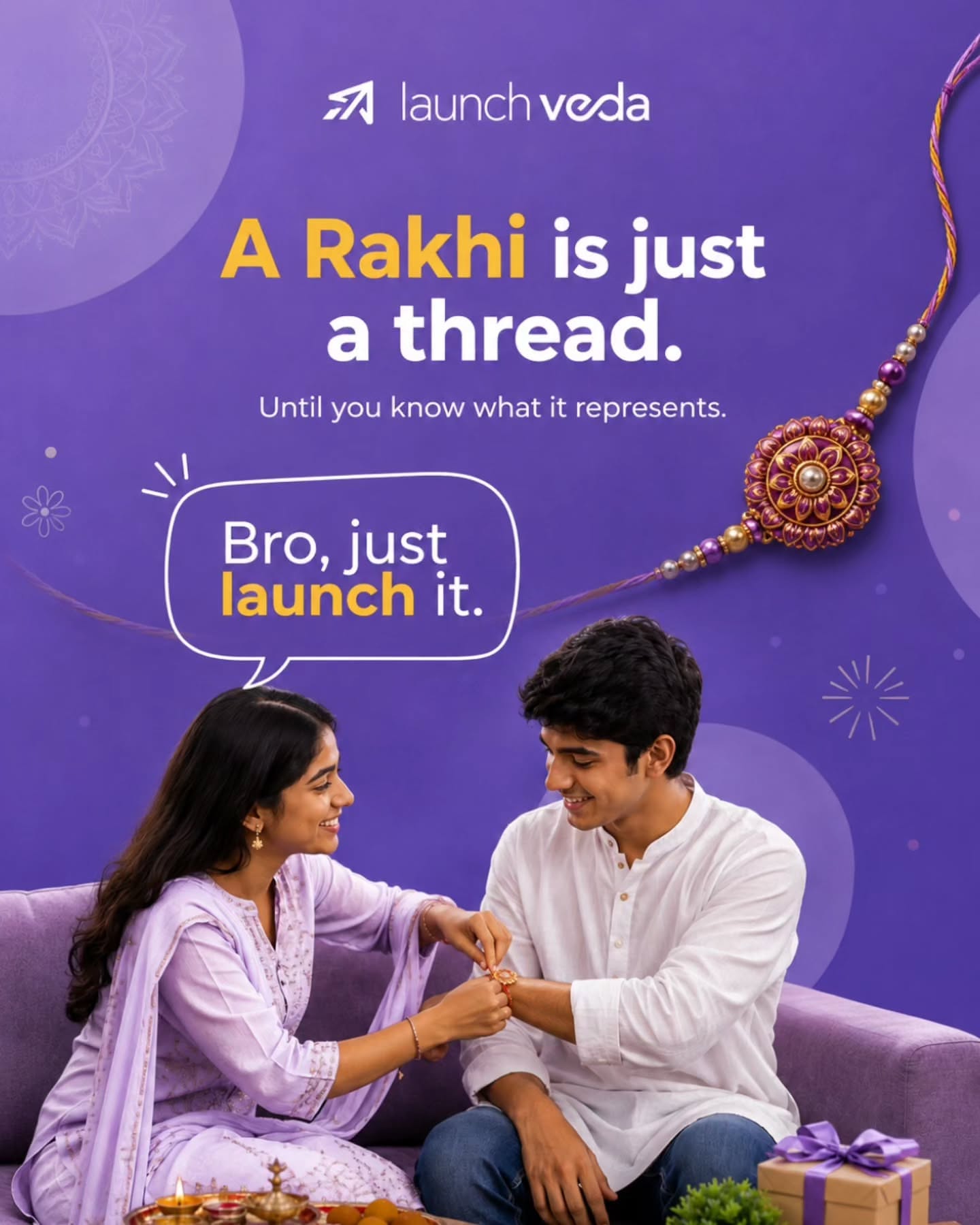 Sister tying a rakhi on her brother on a lilac sofa
