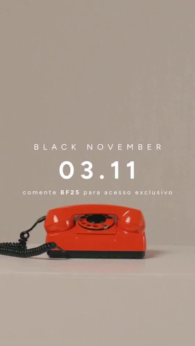 Red vintage rotary phone on a pale surface