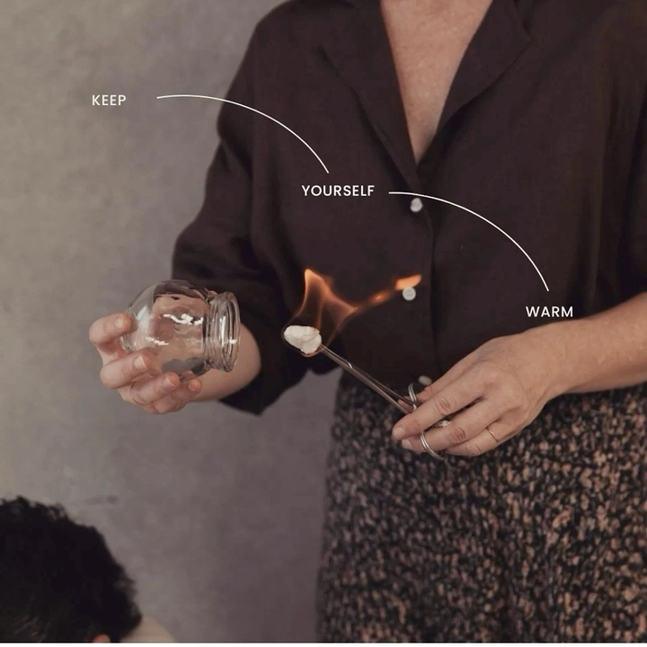 Acupuncture & Cupping Clinics creative ad: Warmth concept integrated into portrait