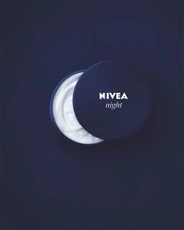 Skincare & Cosmetics creative ad: Open cream tin forming a crescent moon