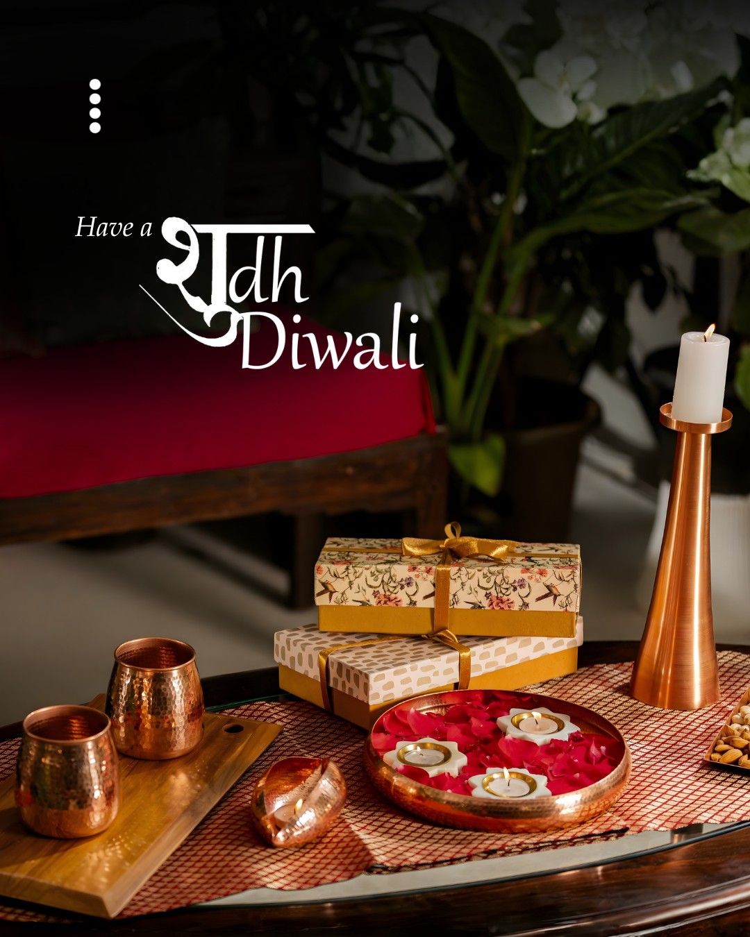 Diwali Instagram post: Styled table of copper tableware, floral gift boxes and a diya urli