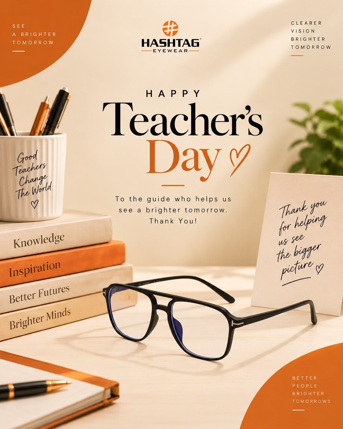 Black eyeglasses on a desk with books and stationery