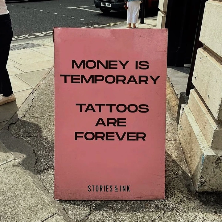 Tattoo Studios creative ad: Witty 'money temporary, tattoos forever' board
