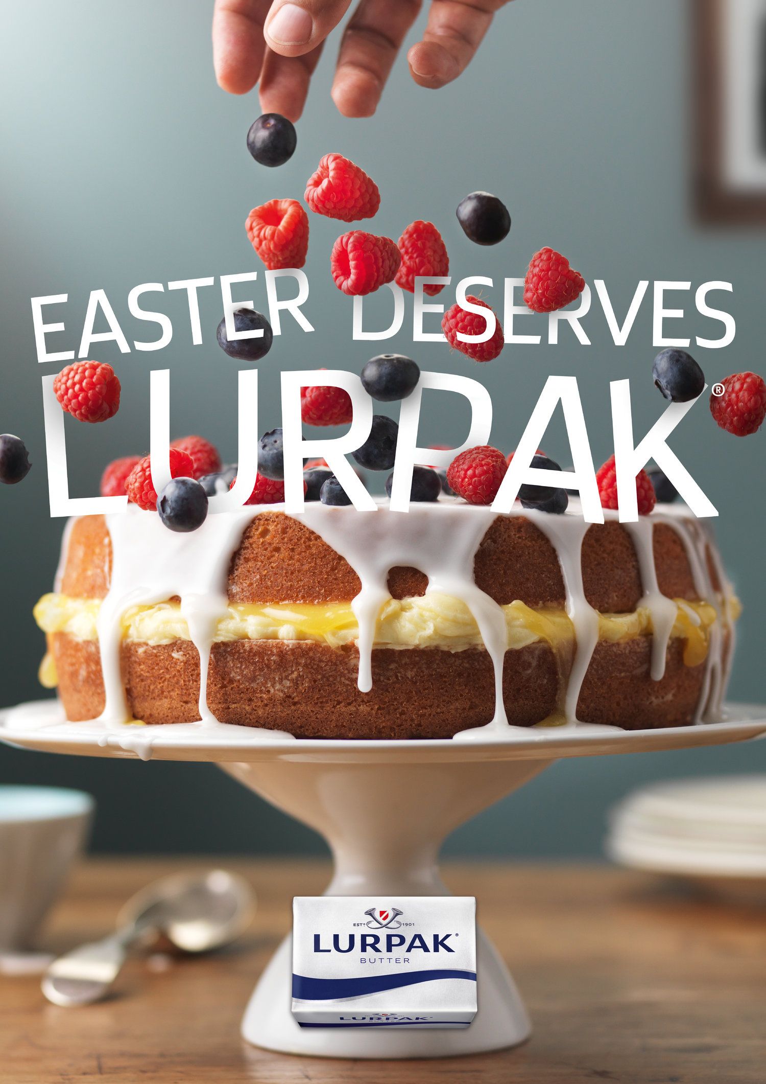 Easter Poster: Iced sponge cake with falling berries