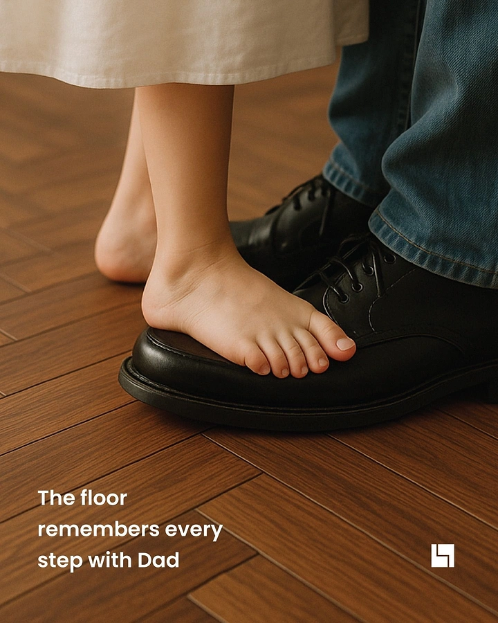Father's Day creative ad: Child's bare feet standing on father's black shoes on a wooden floor