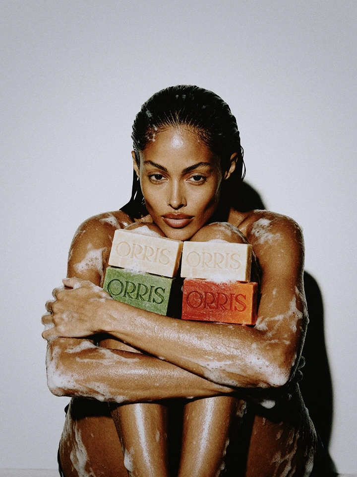 Beauty & Salon creative ad: Lathered model hugging four coloured soap bars