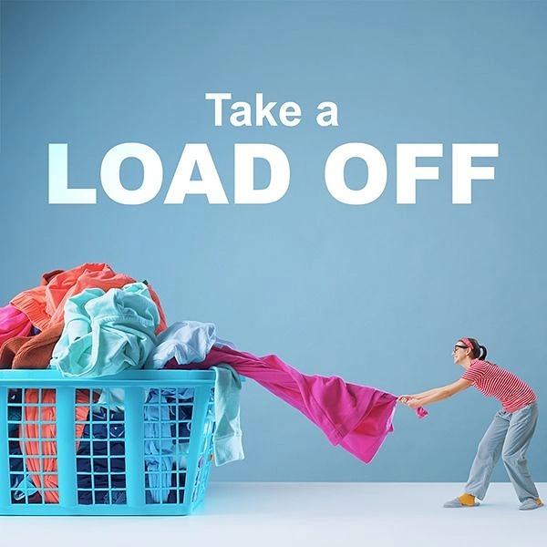 Laundry & Dry Cleaning creative ad: Tiny woman tugging giant laundry, 'load off' pun