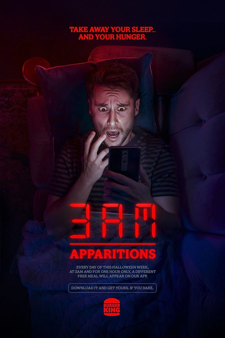 Halloween creative ad: Frightened man in bed staring at his phone at night