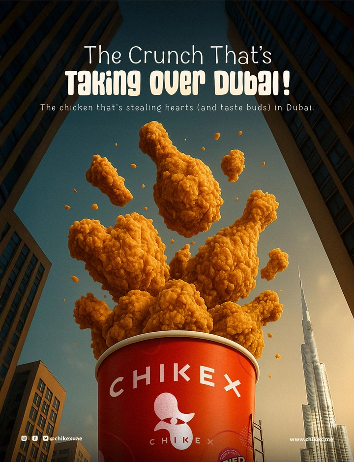Creative ad: Giant red chicken bucket erupting fried chicken among Dubai skyscrapers