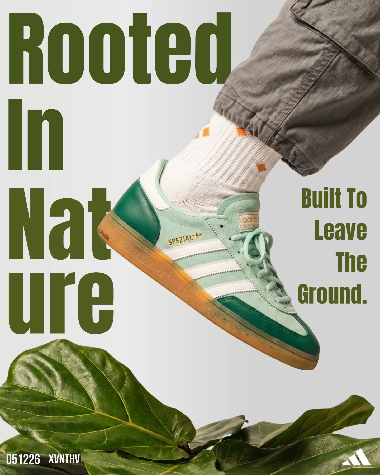 Carousel: Model in pale blue sweats holding several green suede sneakers, slide 2