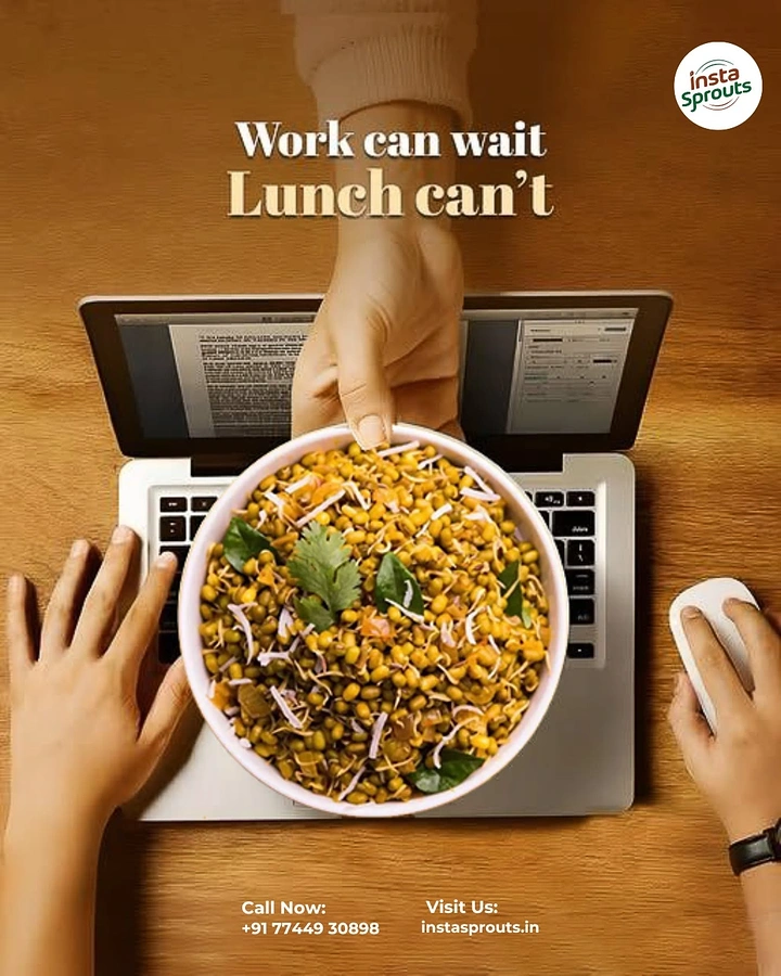 Organic & Farm Produce creative ad: Top-down hand passing a bowl of sprouts salad over a laptop at a work desk