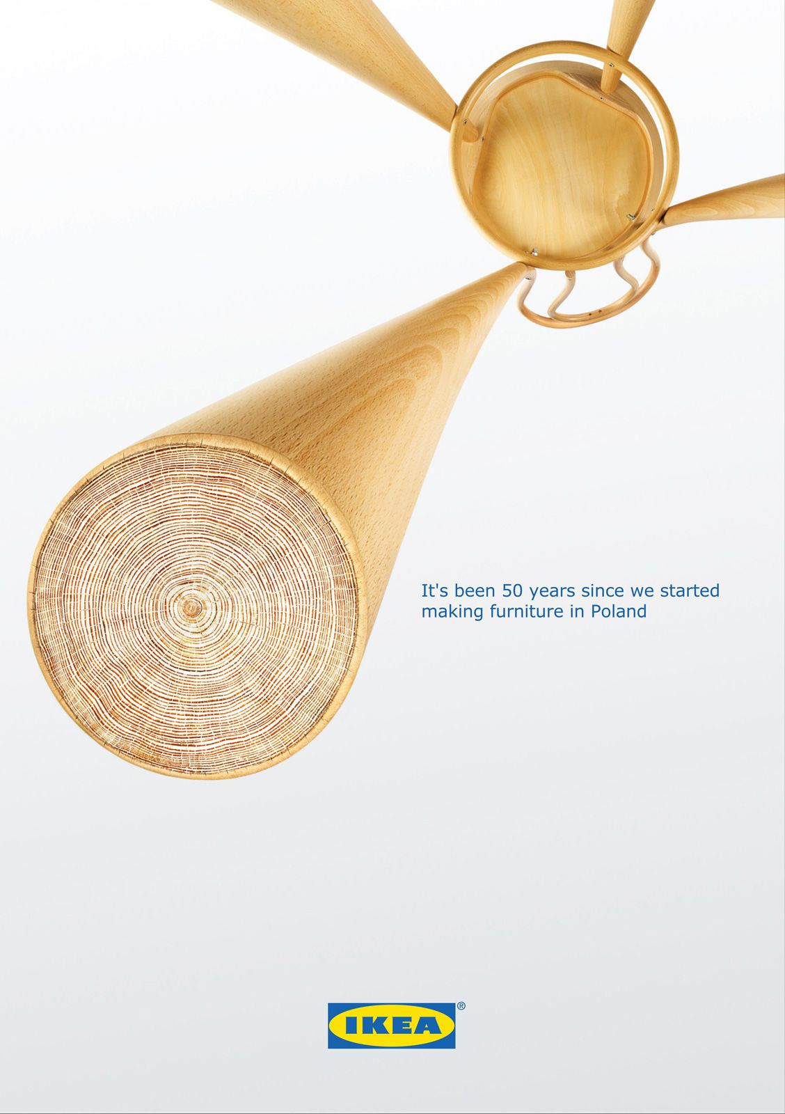 Poster: Stool viewed from below with one leg ending in tree growth rings
