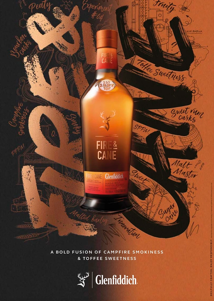 Beer, Wine & Spirits creative ad: Amber whisky bottle over giant brush-script lettering