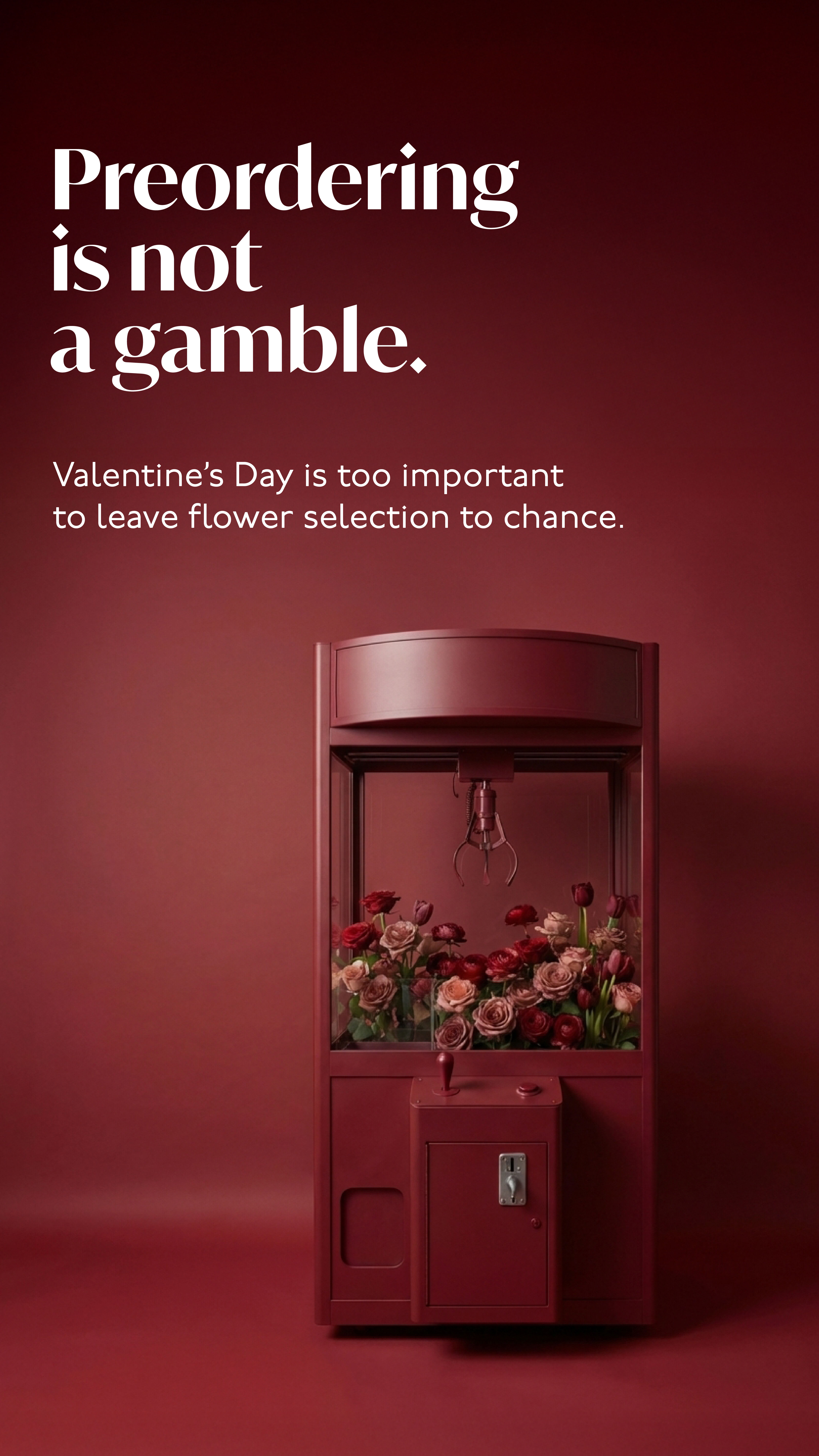 Burgundy claw-crane arcade machine filled with roses