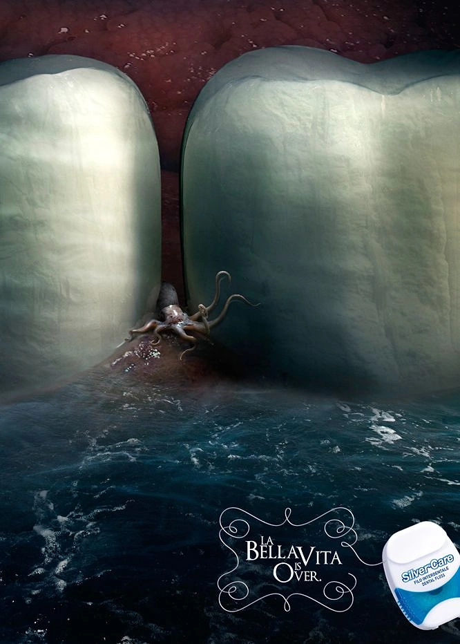 Dental creative ad: Octopus trapped between giant teeth-cliffs