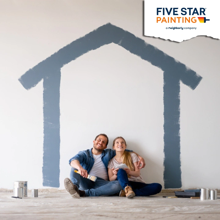 House Painters creative ad: Painted house outline sheltering couple