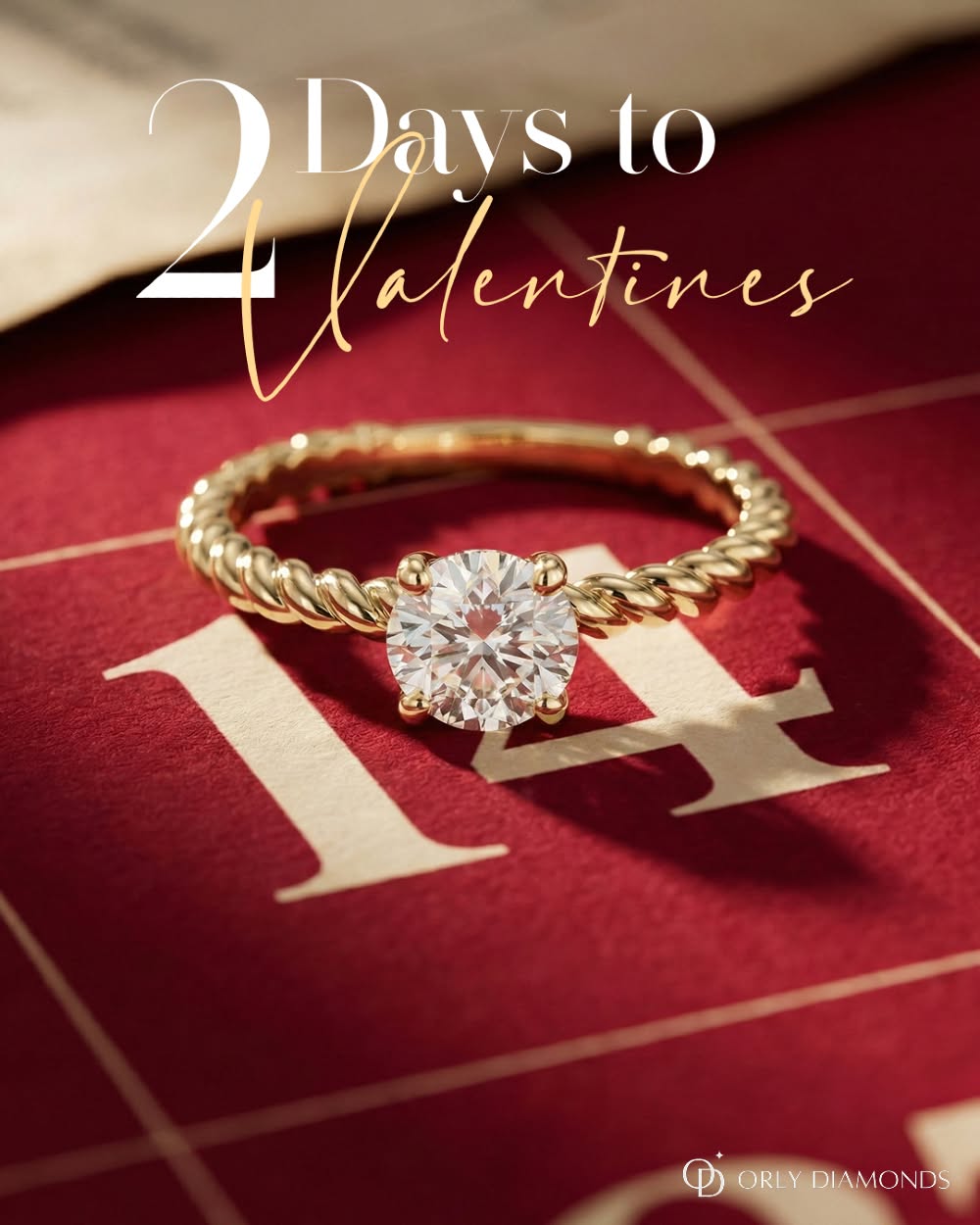 Valentine's Day Instagram post: Gold rope-twist solitaire diamond ring resting on the 14 of a red calendar page