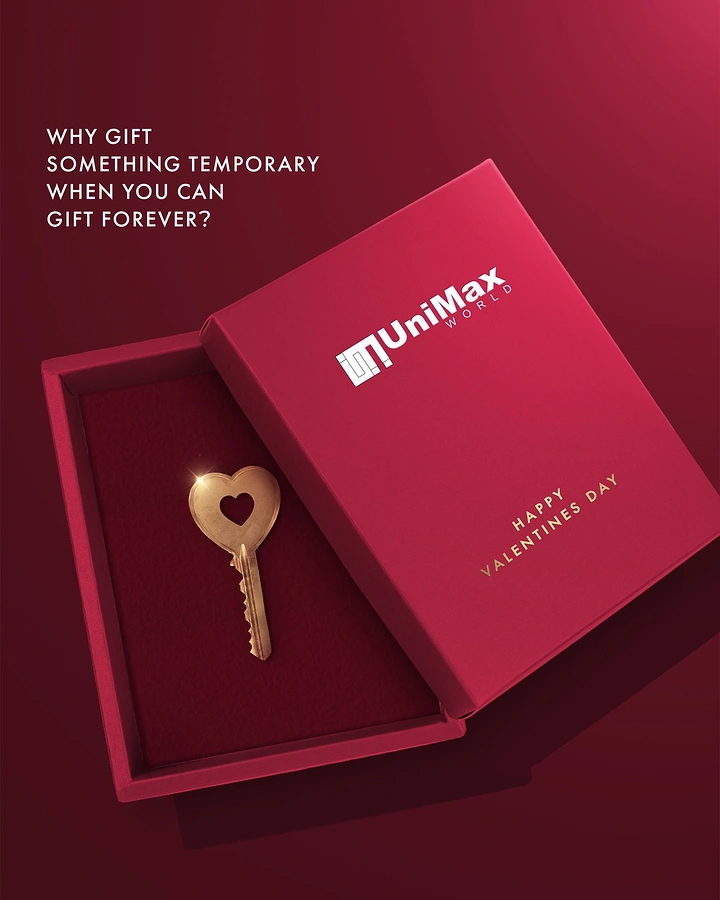 Valentine's Day creative ad: Open crimson gift box holding a gold heart-shaped key