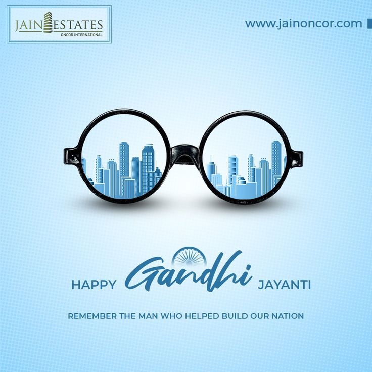 Round Gandhi spectacles with a skyline seen in the lenses