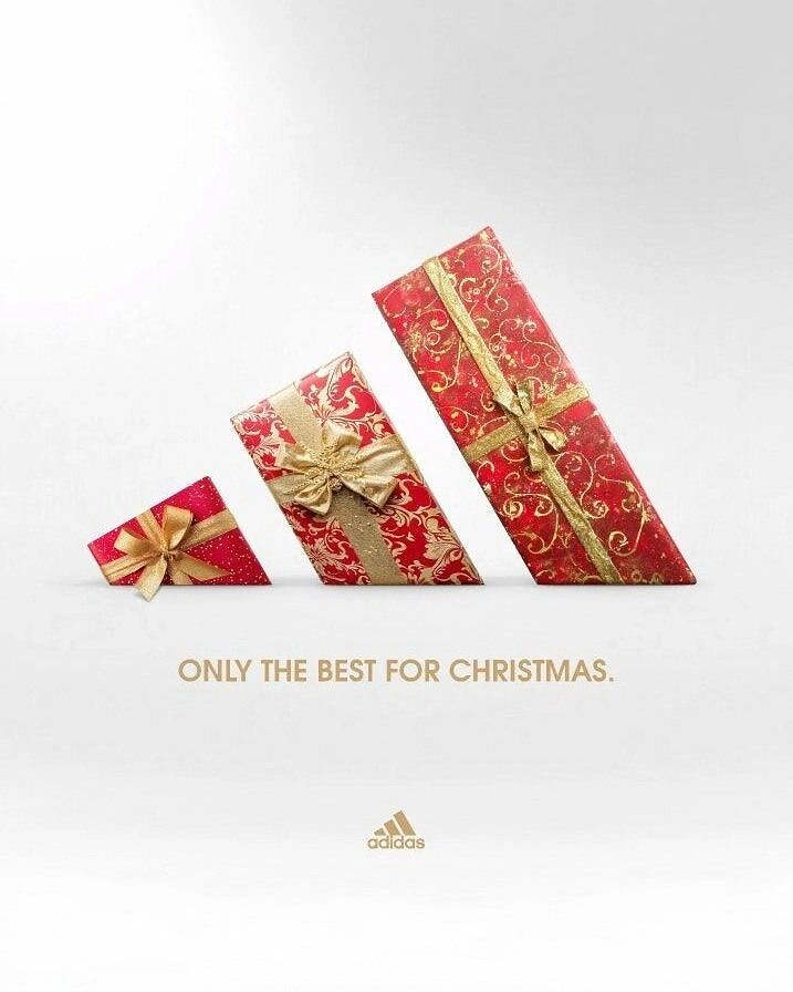 Christmas creative ad: Three tilted gift boxes forming the three-stripe logo
