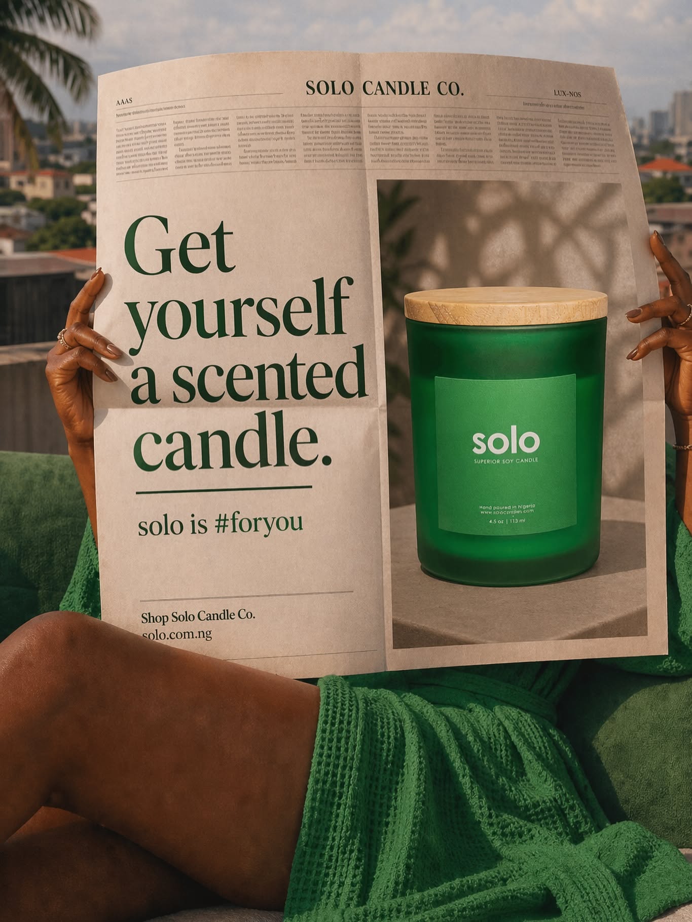 Instagram post: Woman holding a newspaper ad showing a green candle jar