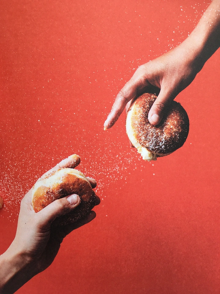Donut Shops creative ad: Plain donut-sharing photograph